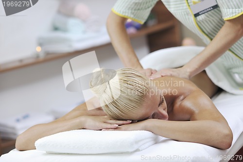 Image of woman at spa and wellness back massage