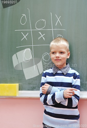 Image of happy young boy at first grade math classes 