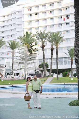 Image of happy seniors couple  on beach