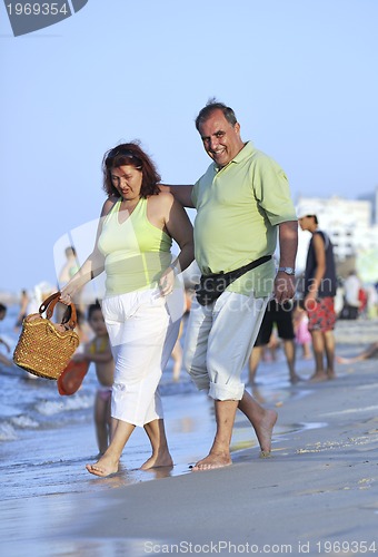 Image of happy seniors couple  on beach