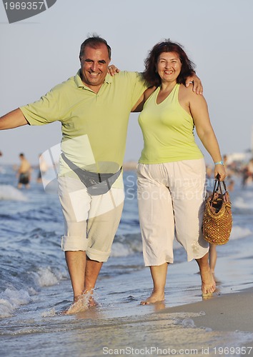 Image of happy seniors couple  on beach