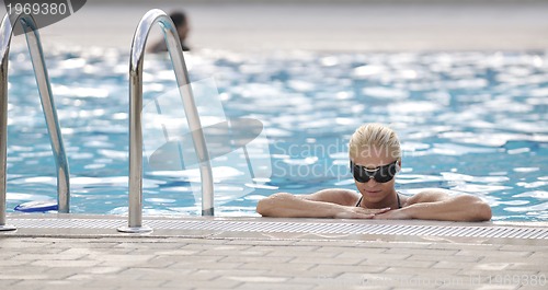 Image of woman relax on swimming pool