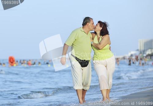 Image of happy seniors couple  on beach