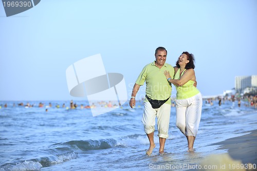 Image of happy seniors couple  on beach