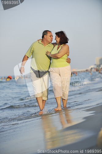 Image of happy seniors couple  on beach