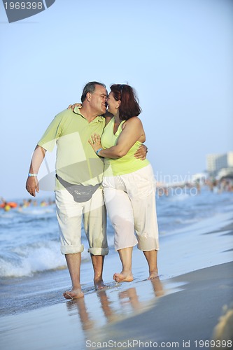 Image of happy seniors couple  on beach