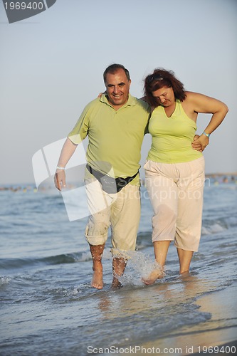 Image of happy seniors couple  on beach