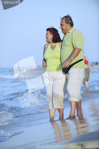 Image of happy seniors couple  on beach