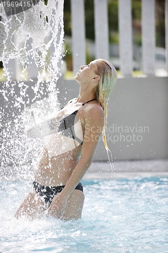 Image of beautiful woman relax on swimming pool