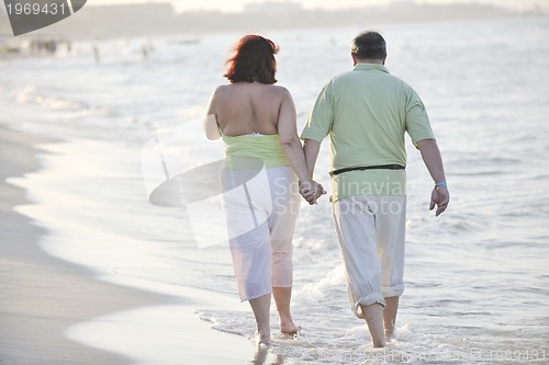 Image of happy seniors couple  on beach