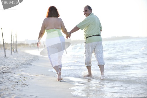 Image of happy seniors couple  on beach