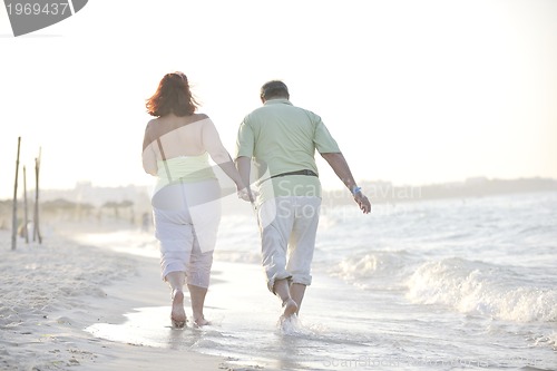 Image of happy seniors couple  on beach