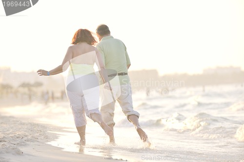 Image of happy seniors couple  on beach