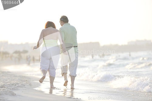 Image of happy seniors couple  on beach