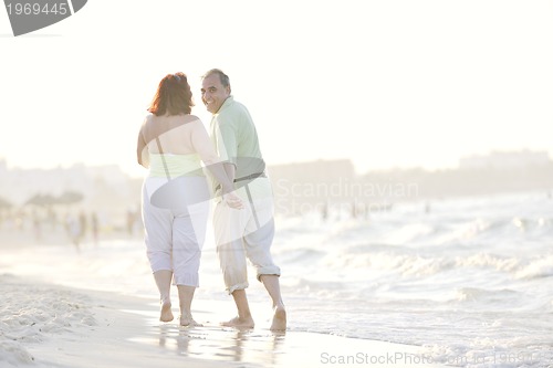 Image of happy seniors couple  on beach