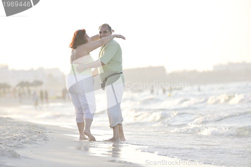 Image of happy seniors couple  on beach