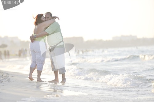 Image of happy seniors couple  on beach