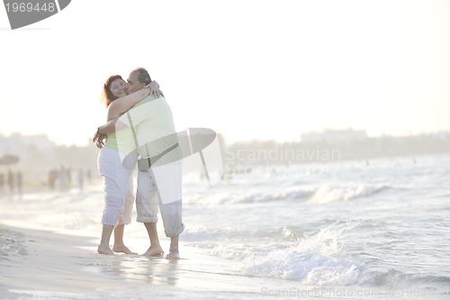 Image of happy seniors couple  on beach