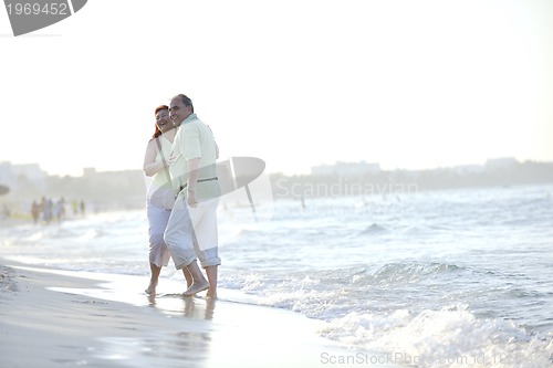 Image of happy seniors couple  on beach