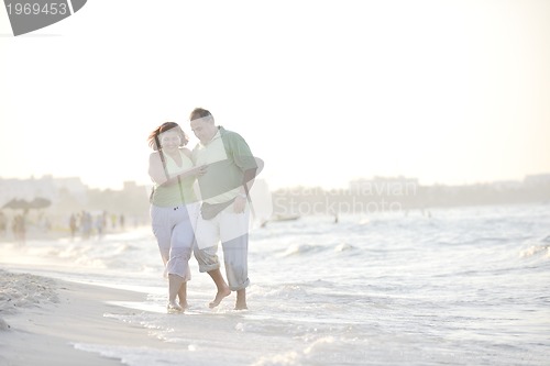 Image of happy seniors couple  on beach