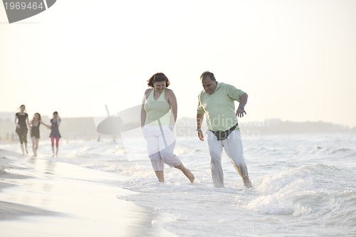 Image of happy seniors couple  on beach