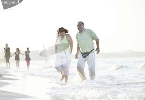 Image of happy seniors couple  on beach