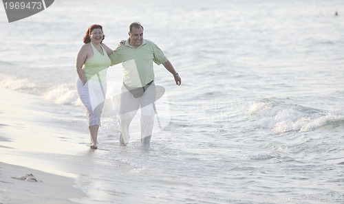 Image of happy seniors couple  on beach