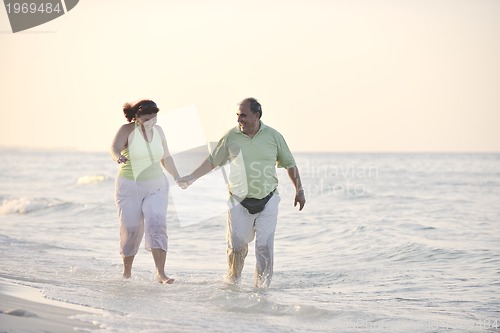 Image of happy seniors couple  on beach