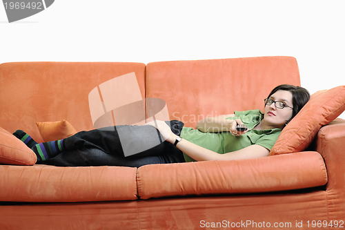 Image of happy woman relax on orange sofa