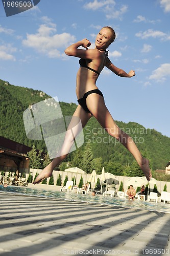 Image of woman relax on swimming pool