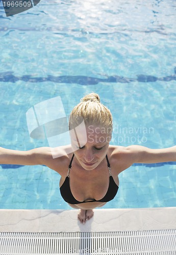 Image of woman relax on swimming pool