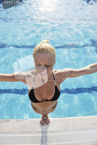 Image of woman relax on swimming pool