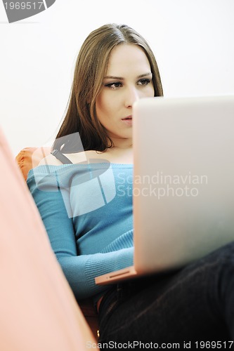 Image of one young woman working on laptop