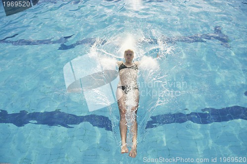 Image of woman relax on swimming pool