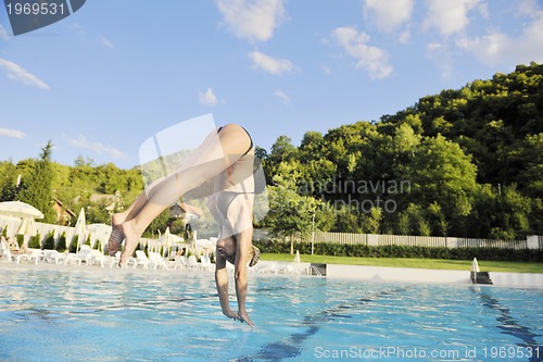 Image of beautiful woman relax on swimming pool