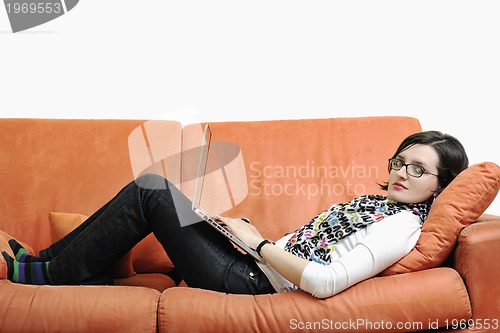 Image of one young woman working on laptop 