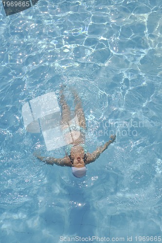 Image of woman relax at swimming pool 