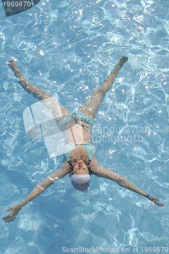 Image of woman relax at swimming pool 