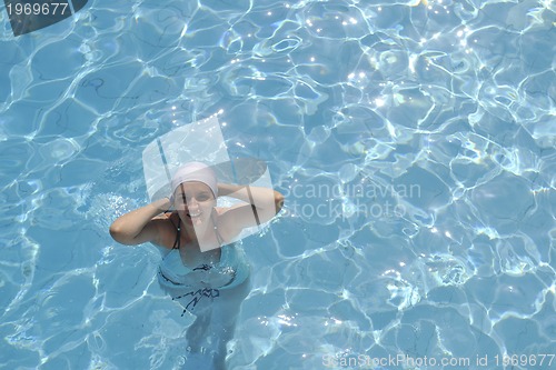 Image of woman relax at swimming pool 
