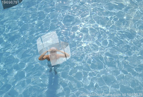 Image of woman relax at swimming pool 