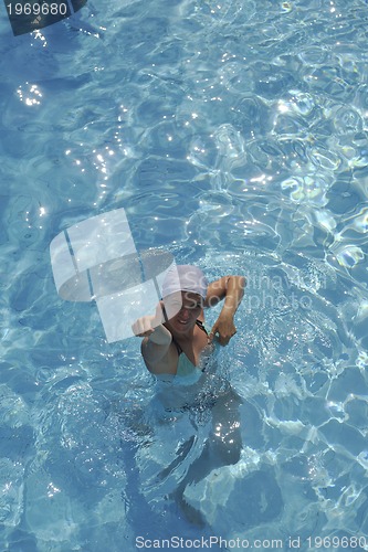 Image of woman relax at swimming pool 