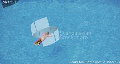 Image of woman relax at swimming pool 