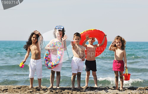 Image of child group have fun and play with beach toys