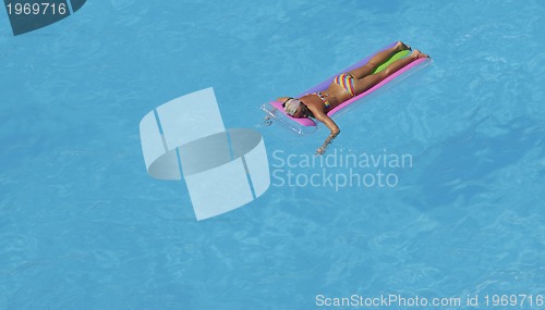 Image of woman relax at swimming pool 