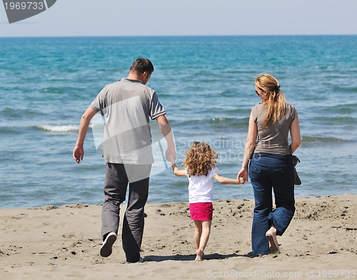 Image of happy young family have fun on beach