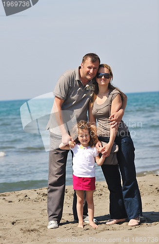Image of happy young family have fun on beach
