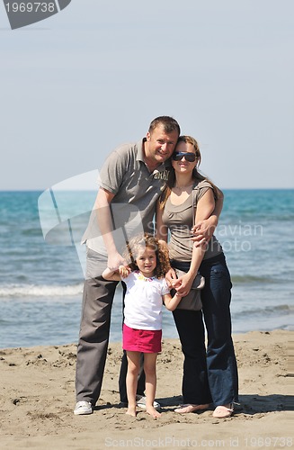 Image of happy young family have fun on beach