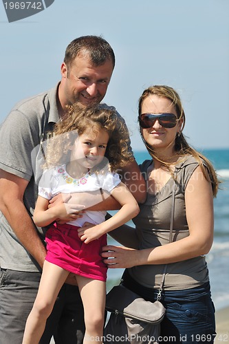 Image of happy young family have fun on beach