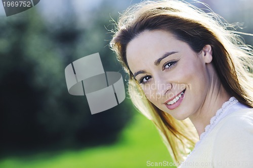 Image of young woman outdoor portrait