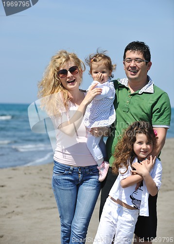 Image of happy young family have fun on beach